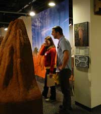 people looking at an exhibit